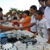 Veraguas festival goers look over a table of cheap and sweet treats in Panama