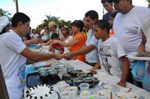 Veraguas festival goers look over a table of cheap and sweet treats in Panama