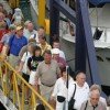 Visitors to panama disembark from a cruise ship