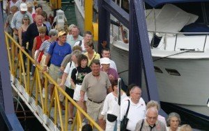 Visitors to panama disembark from a cruise ship