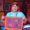 A Guna woman displays mola art she has crafted.